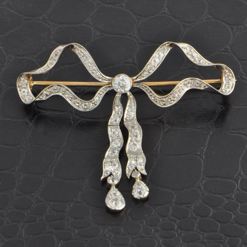 vintage wedding brooches for women-Antique Edwardian Diamond Bow Brooch in 18k Yellow Gold and Platinum